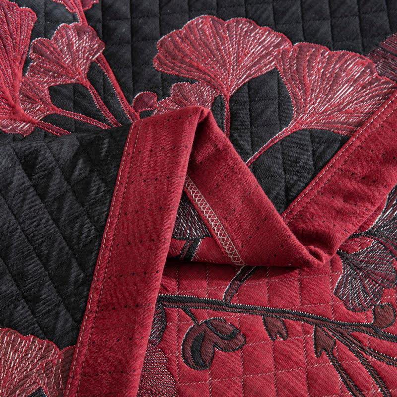 Herbstglanz Wendedecke – Baumwollquilt mit Gingko-Blatt-Muster in Orange