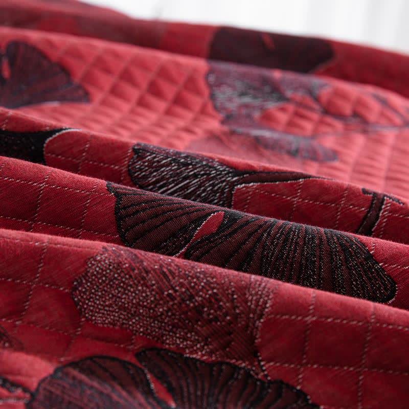 Herbstglanz Wendedecke – Baumwollquilt mit Gingko-Blatt-Muster in Orange