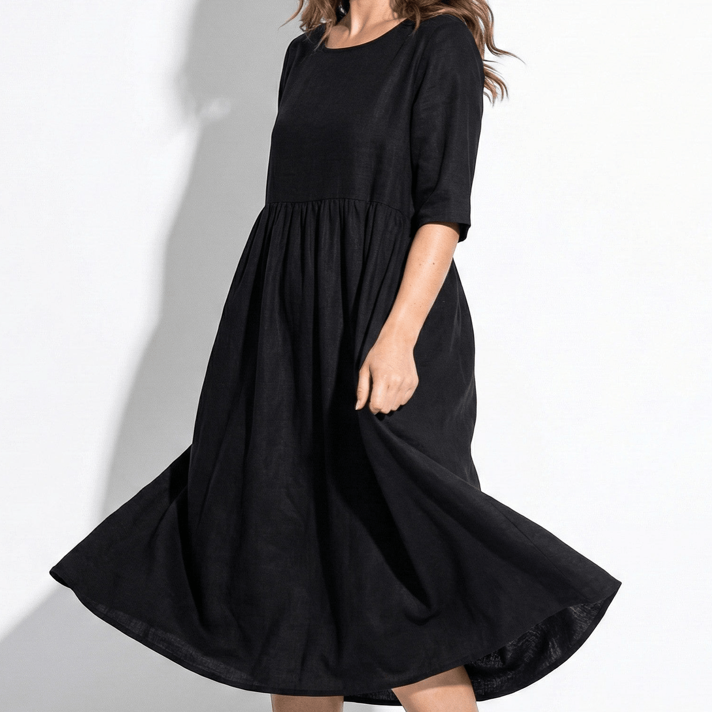 Women's midi dress with round neckline and side pockets