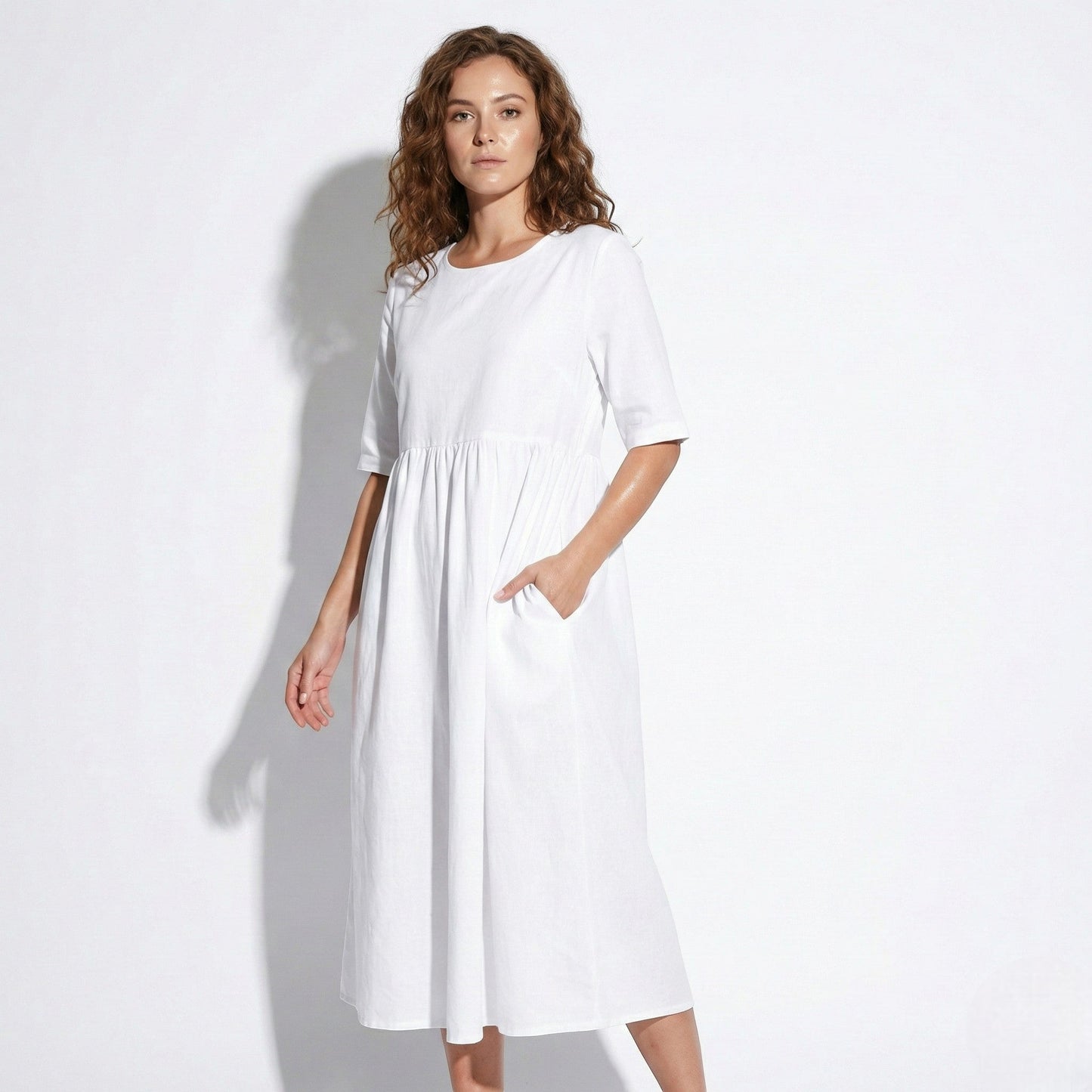 Women's midi dress with round neckline and side pockets